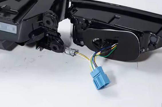 Tail light pigtail showing the blue connector and the small secondary connector before plugging in